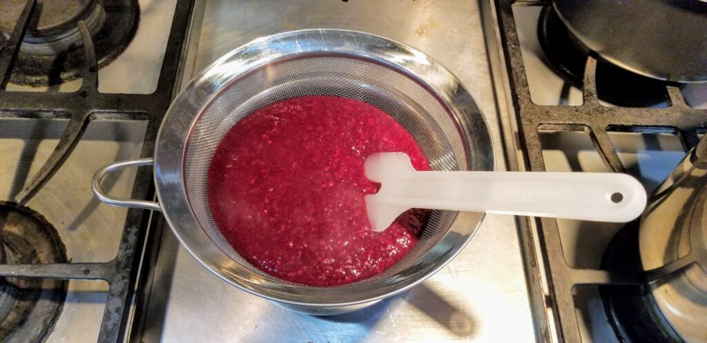 Cranberry sauce in sieve